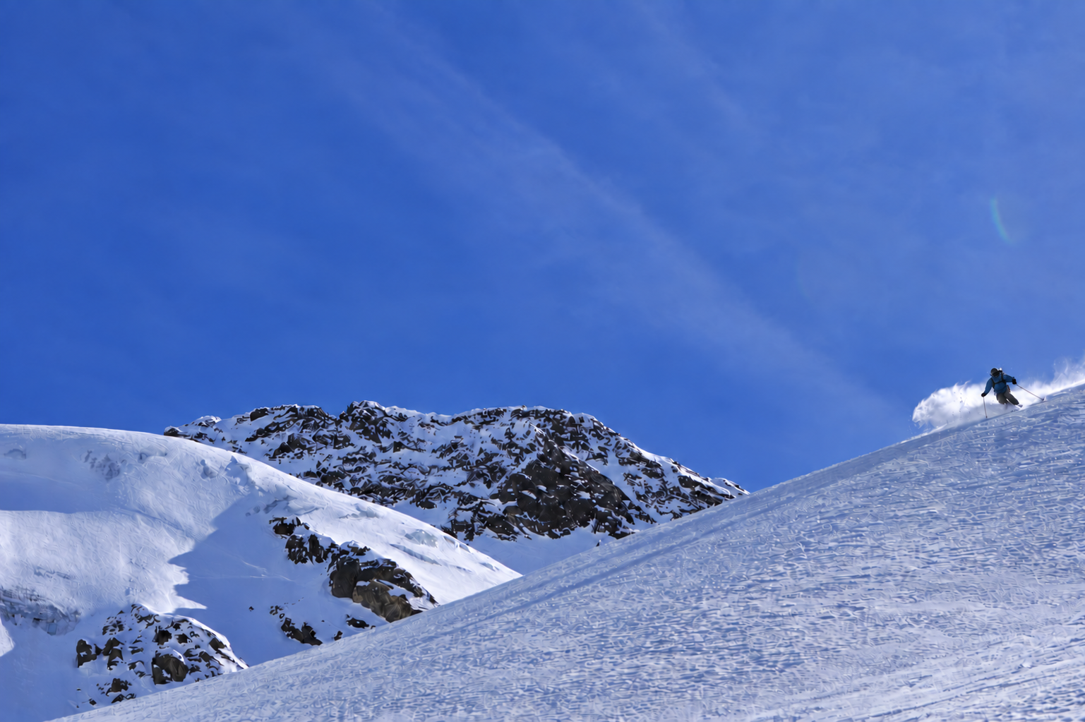 Freeride skier in fresh powder above Obergurgl