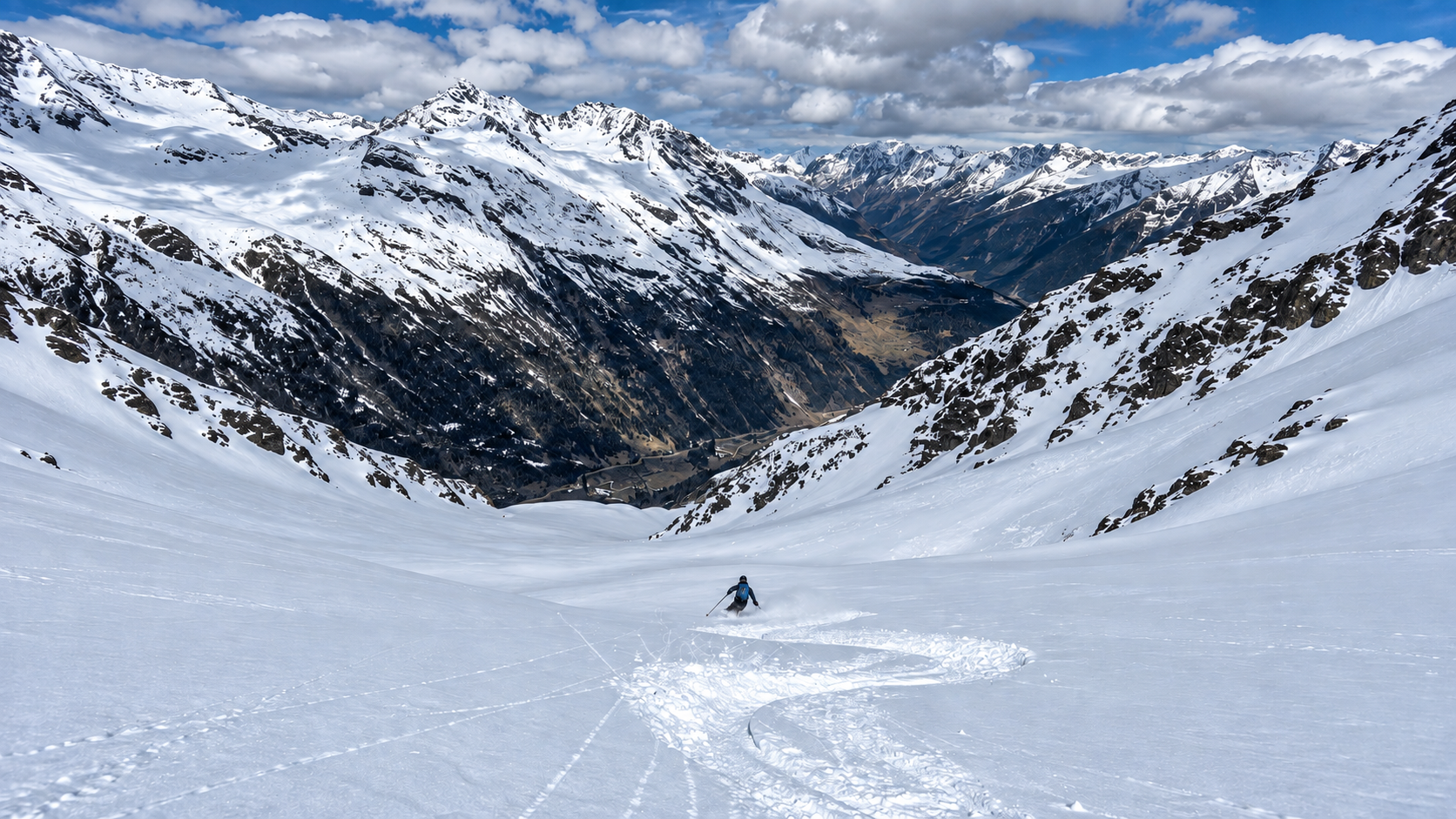 Ski tourer descending from Zirmkogel in the Ötztal Alps